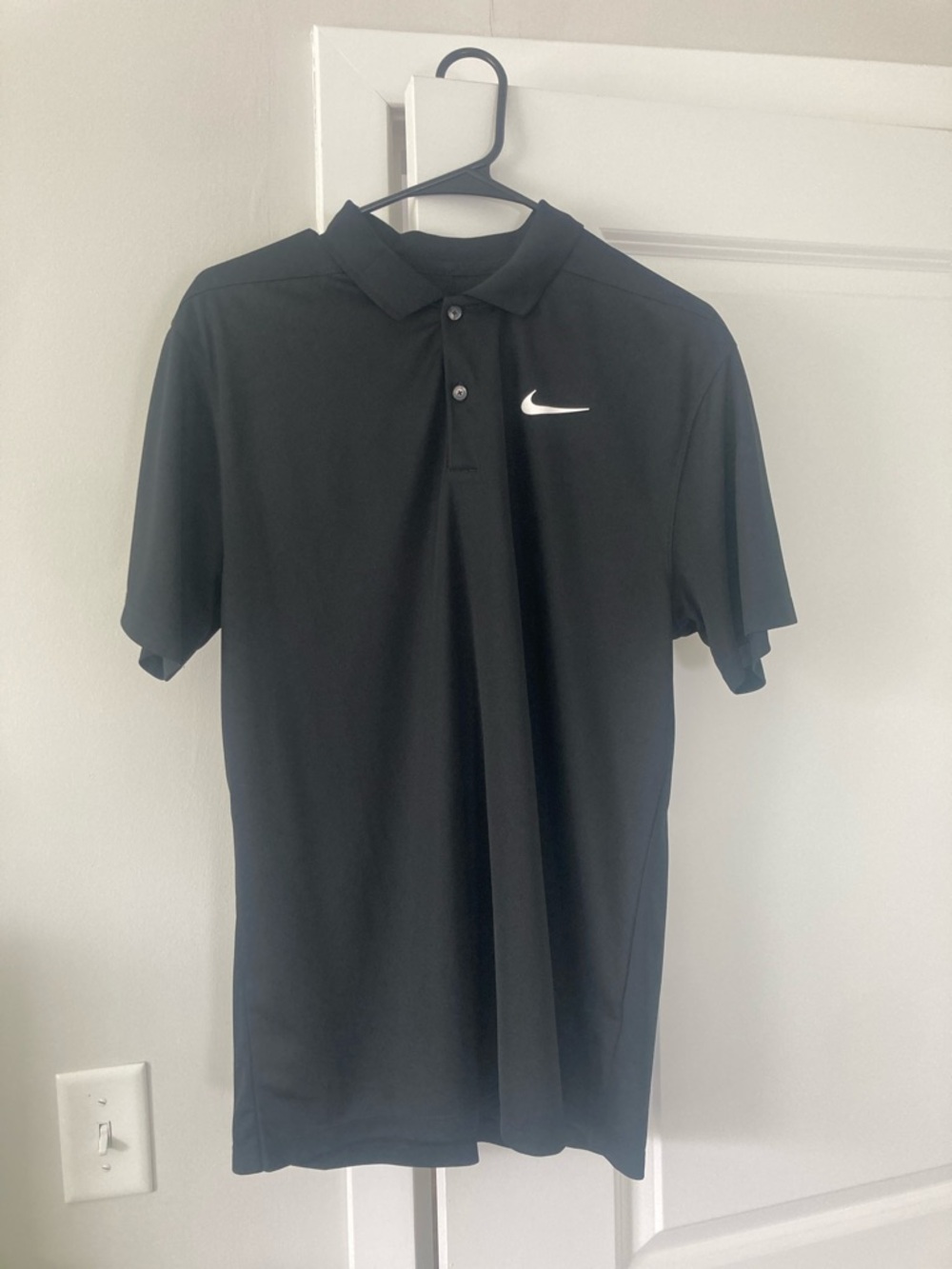 Nike Black Polo Shirt with White Swoosh